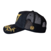A black hat with yellow writing and a gold logo.